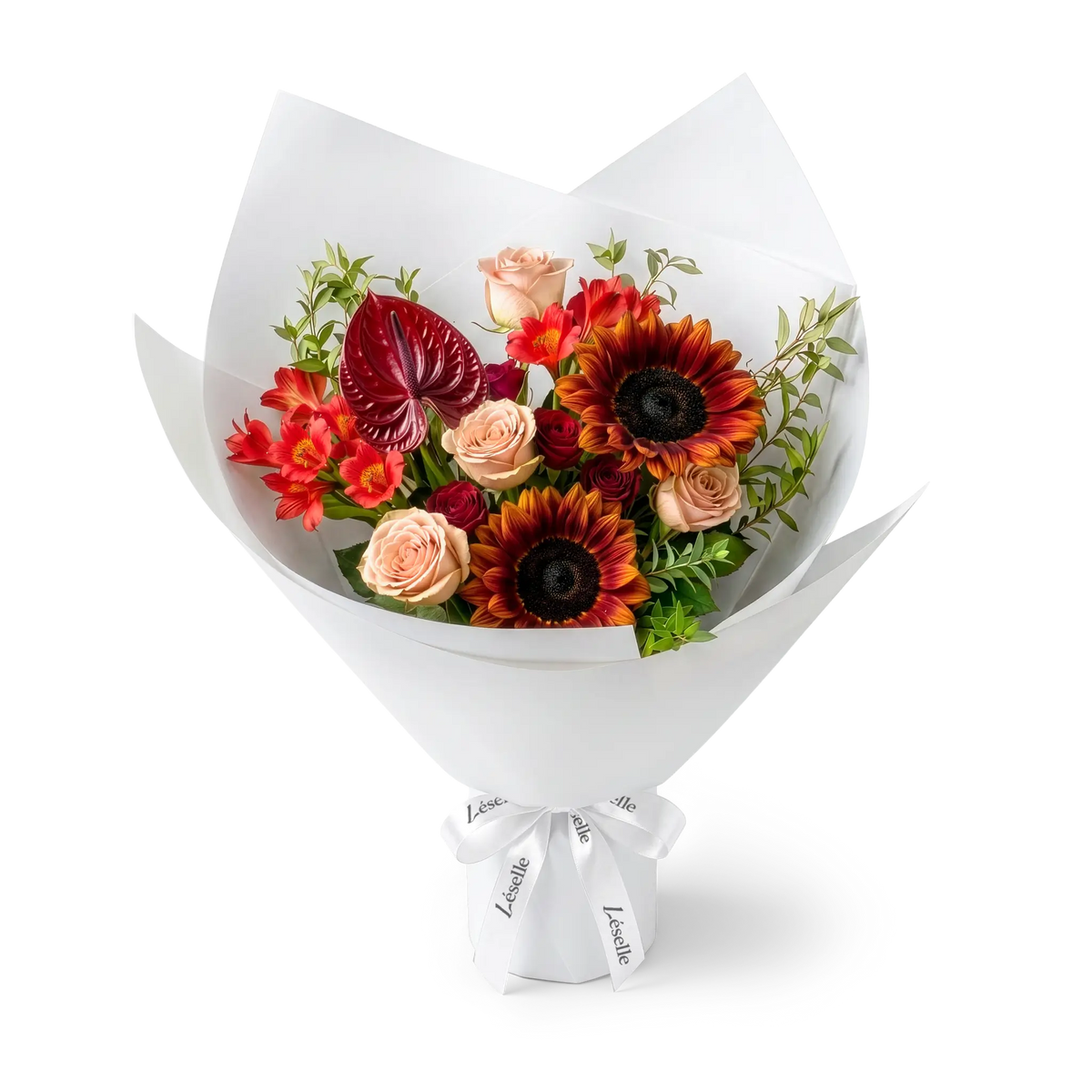 A wrapped flower bouquet featuring burgundy sunflowers, cappuccino roses, a dark red anthurium, and green foliage, wrapped in a white paper sleeve with a white ribbon, on a transparent background.
